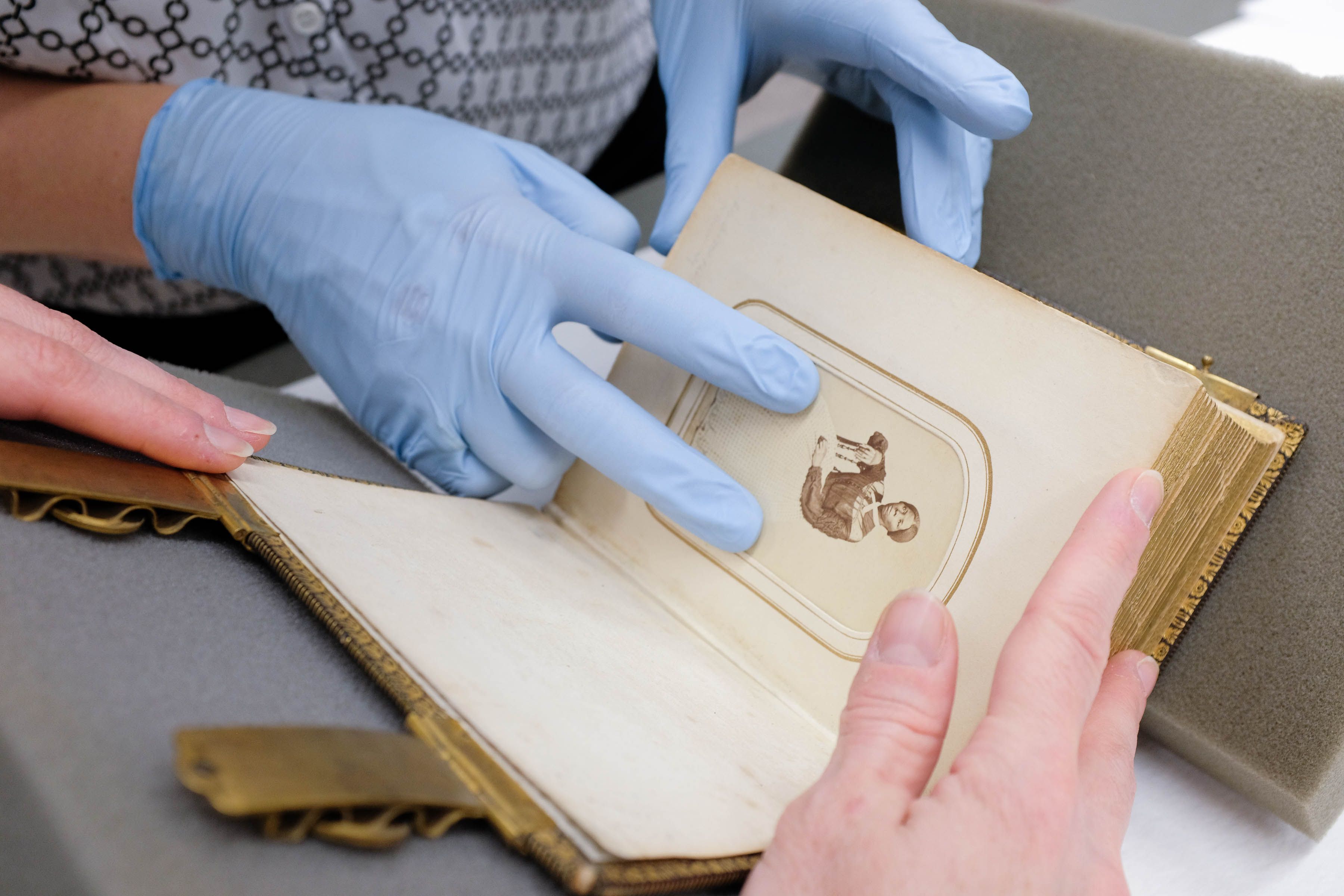 Library of Congress employees restoring a book.
