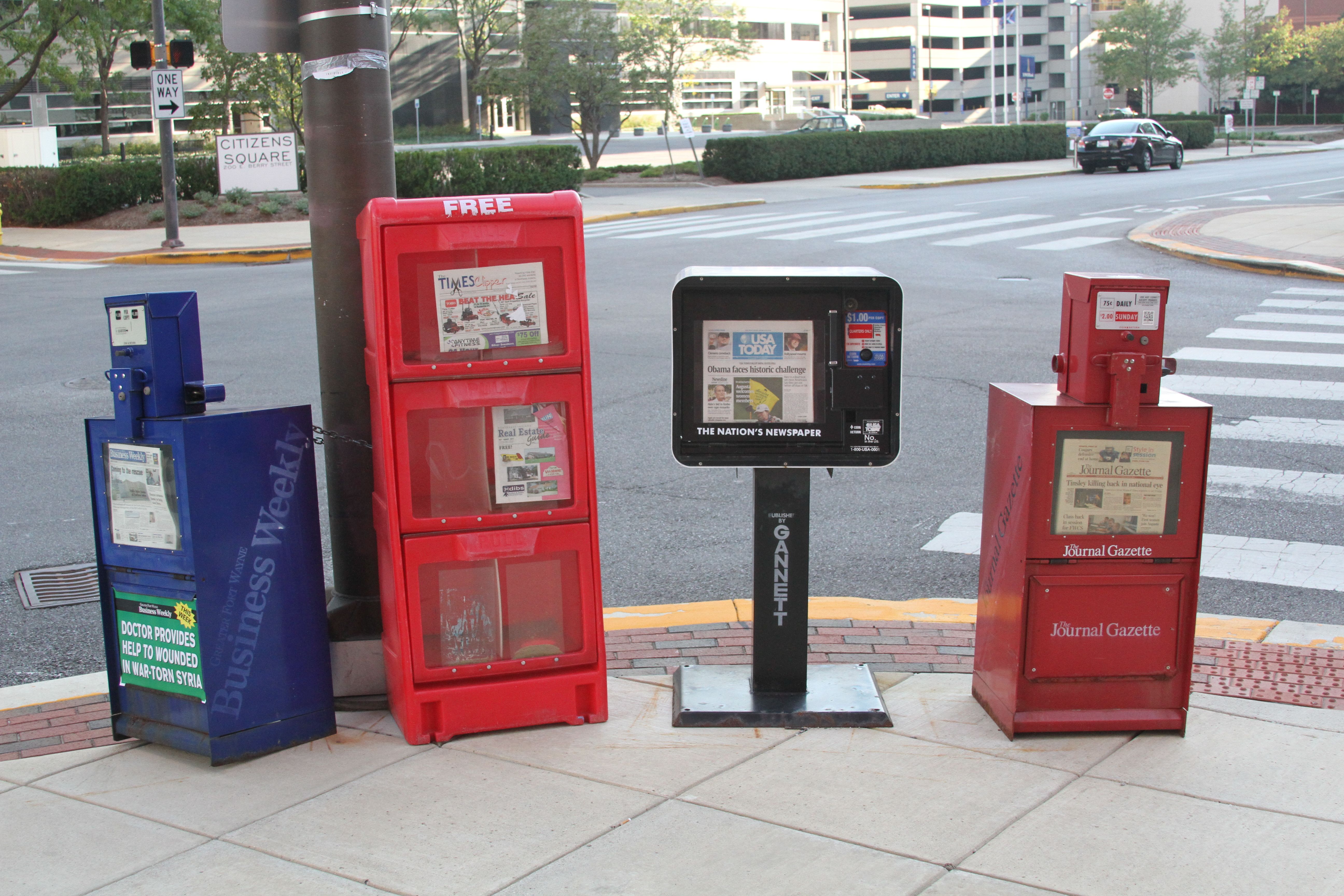 A group of newspaper vending machines.