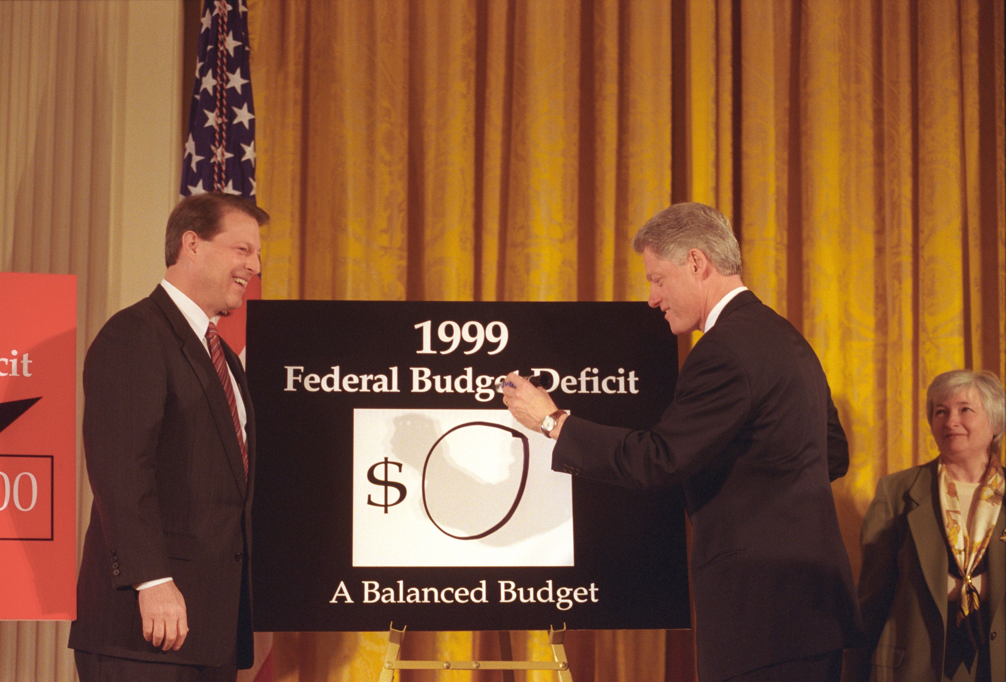 President Clinton announces a federal budget surplus in 1999.